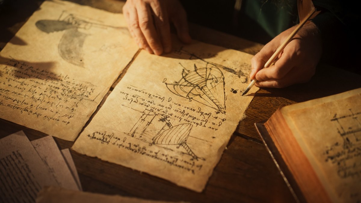 Hand sketching early technical drawings by hand, evoking the company's founding roots