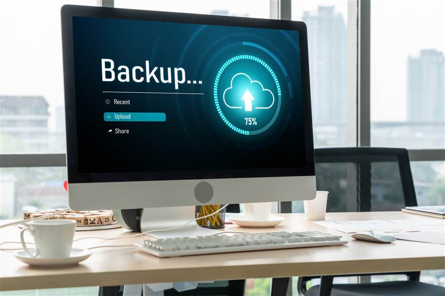 Monitor displaying a cloud backup upload in progress